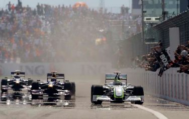 Brawn GP driver Jenson Button of Britain, right, is followed by second placed Red Bull's Mark Webber, center, and third placed Sebastian Vettel as he reacts after crossing the finish line to win the Turkish Formula One Grand Prix at the Istanbul Park racetrack, in Istanbul, Turkey,  Sunday, June 7 2009. (AP Photo/Ibrahim Usta)