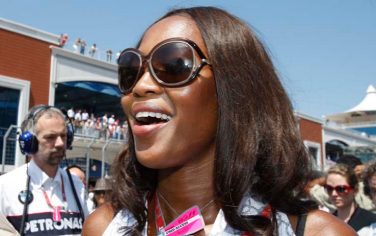 British top model Naomi Campbell smiles at the starting grid prior to the Turkish Formula One Grand Prix at the Istanbul Park racetrack, in Istanbul, Turkey, Sunday, June 7 2009. (AP Photo/Luca Bruno)