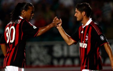 AC Milan's Pato, of Brazil, right, celebrates with compatriot Ronaldinho after scoring during the Italian Serie A soccer match between Siena and AC Milan in Siena, Italy, Saturday, Aug. 22, 2009. (AP Photo/Paolo Lazzeroni)