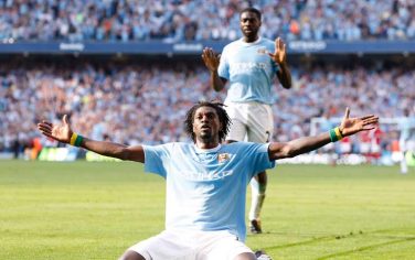 Manchester City's Emmanuel Adebayor celebrates in front of Arsenal supporters after scoring against his former club during their English Premier League soccer match at The City of Manchester Stadium, Manchester, England, Saturday Sept. 12, 2009. To the rear teammate and fellow former Arsenal player Kolo Toure. (AP Photo/Jon Super) ** NO INTERNET/MOBILE USAGE WITHOUT FOOTBALL ASSOCIATION PREMIER LEAGUE (FAPL) LICENCE. CALL +44 (0) 20 7864 9121 or EMAIL info@football-dataco.com FOR DETAILS **